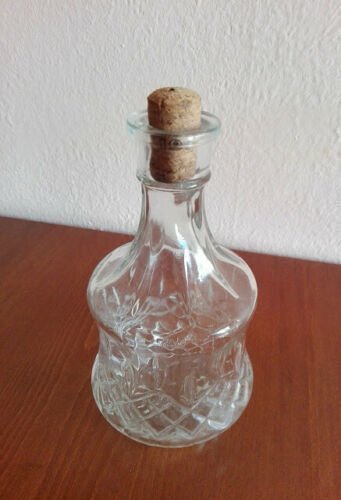 Clear vintage glass carafe, decanter with cork