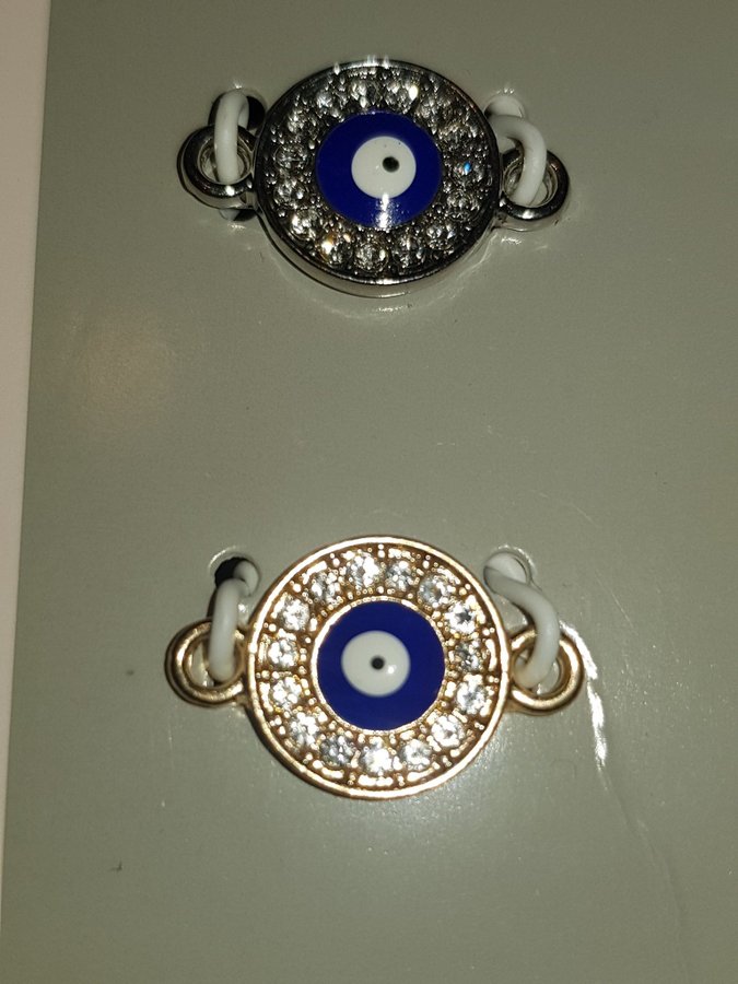 Hängen charms 2 par ögon, evil eye  ovala, guld- och silverfärgade med strass