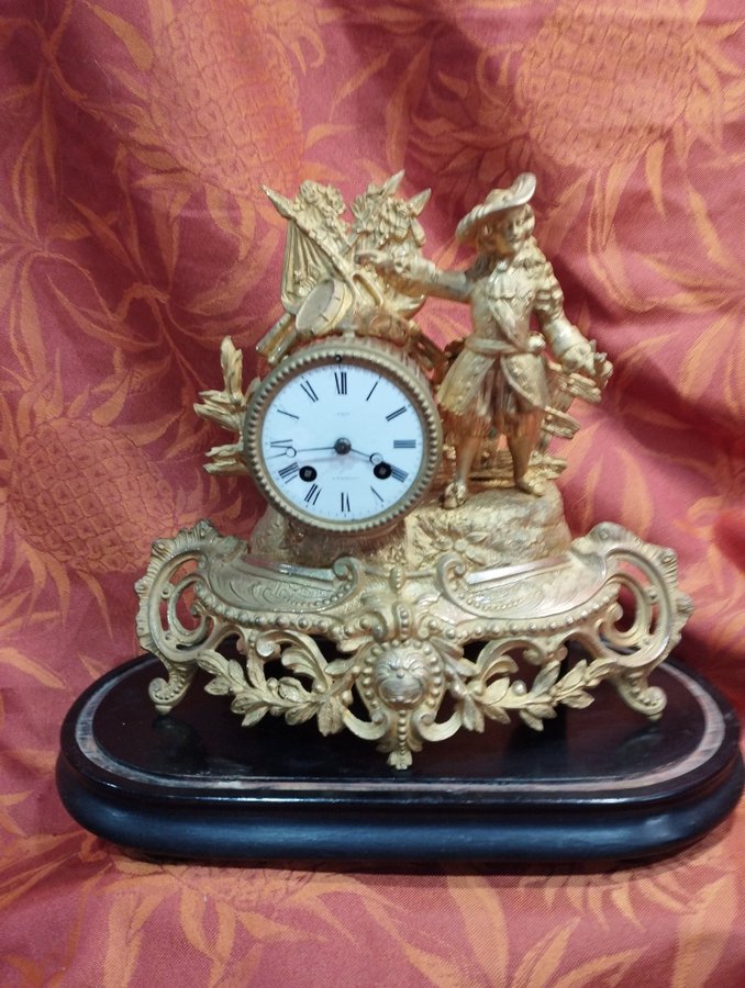 antique gilt regule clock on wooden base