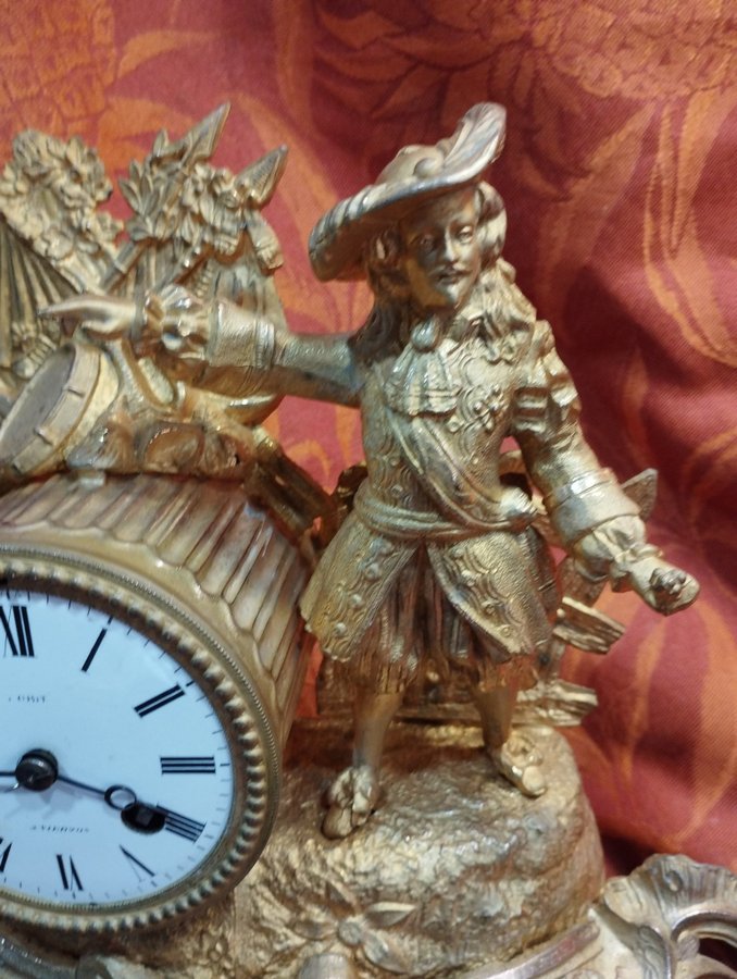 antique gilt regule clock on wooden base