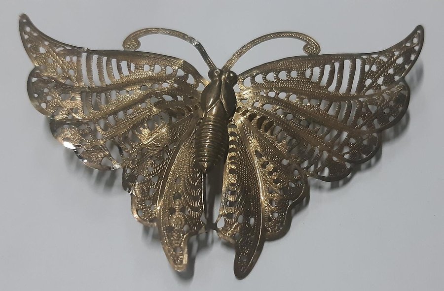 Antique gold metal butterfly brooch