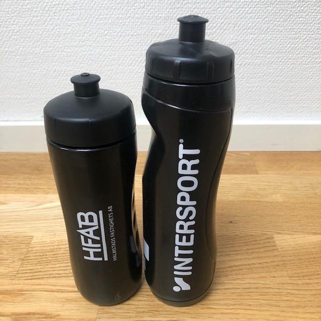 Two black plastic portable water bottles