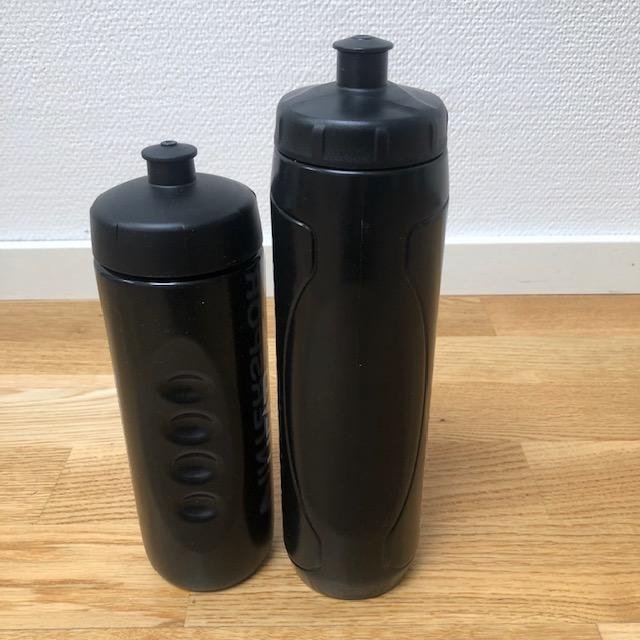 Two black plastic portable water bottles