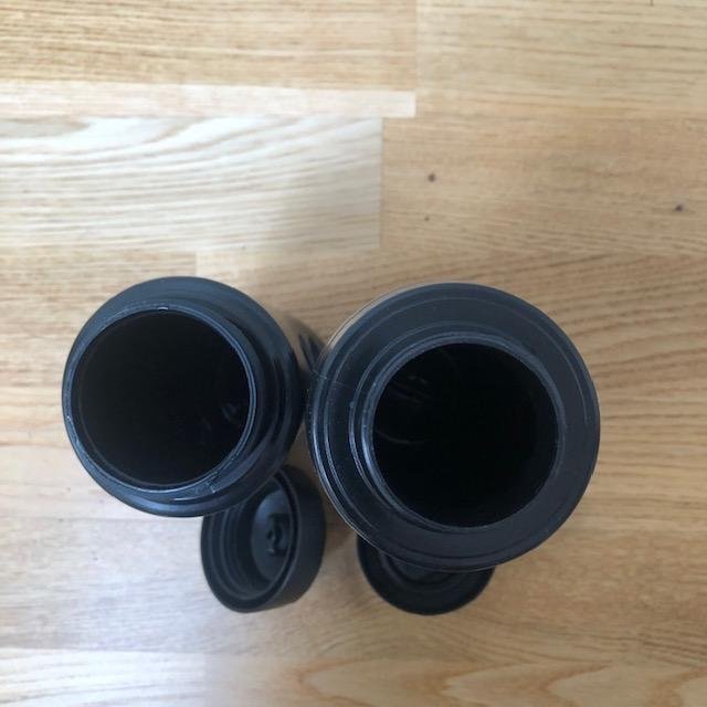 Two black plastic portable water bottles
