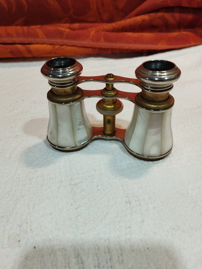 antique pair of opera glasses in mother-of-pearl and brass