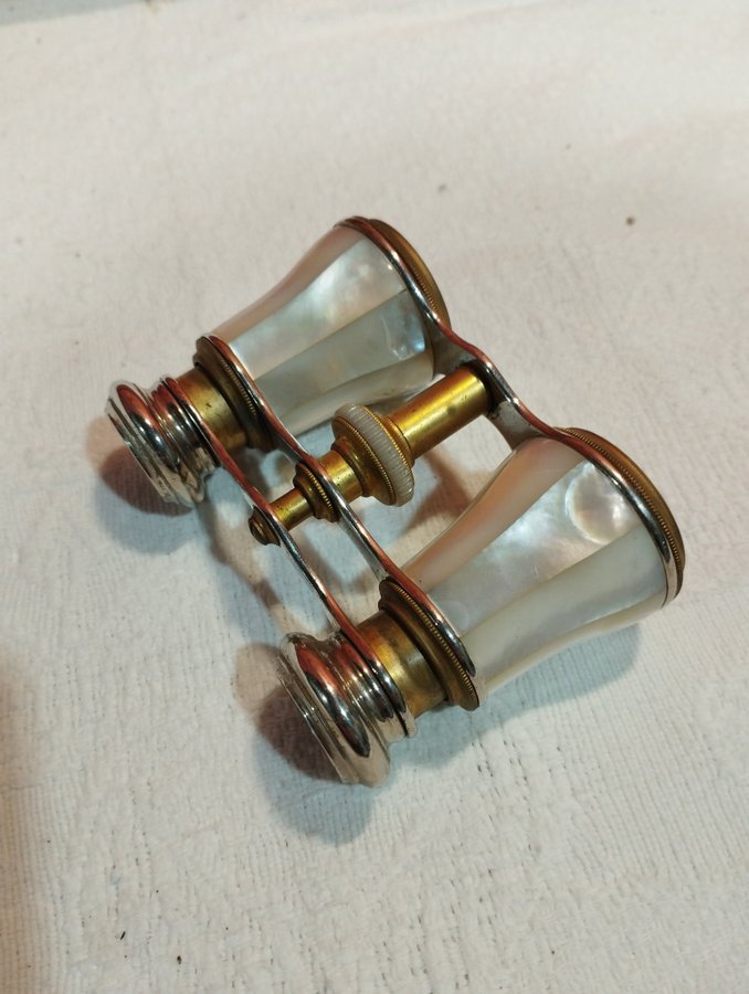 antique pair of opera glasses in mother-of-pearl and brass