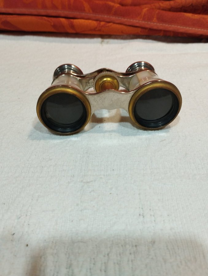 antique pair of opera glasses in mother-of-pearl and brass