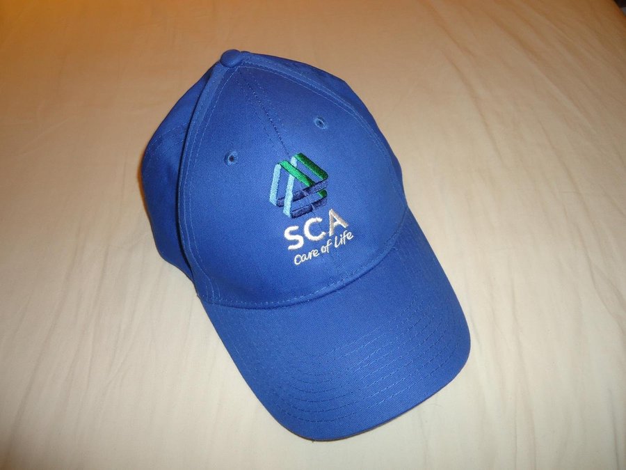 SCA keps baseball cap hat blå med broderad logotype i vit/grön färg skogsbolag