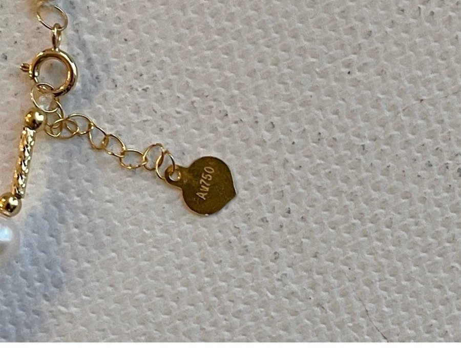 armband:18k guld med äkta pärla