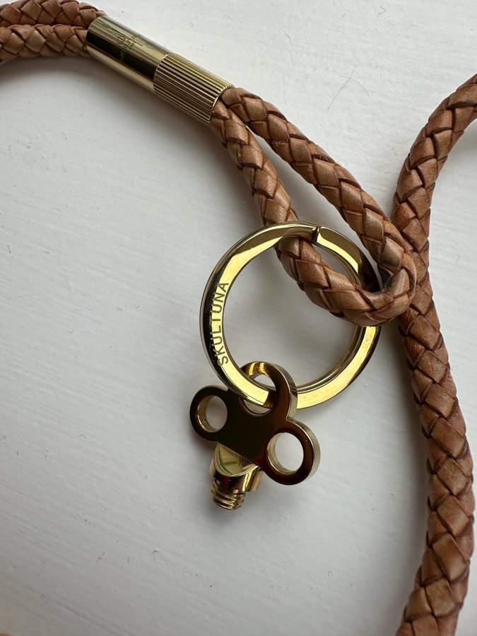 Skultuna gold/ leather keychain and necklace