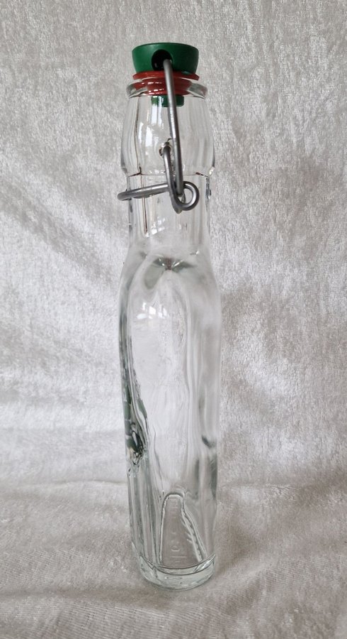 Äldre retro flaska plunta i glas med roligt motiv