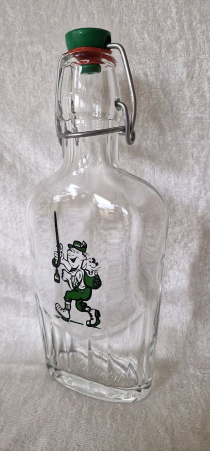 Äldre retro flaska plunta i glas med roligt motiv