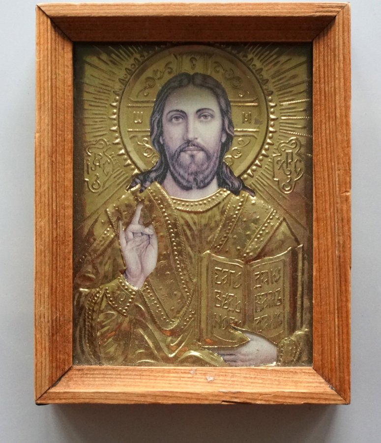 Gammal inglasad Jesus ikon med trä ram och hörn metall