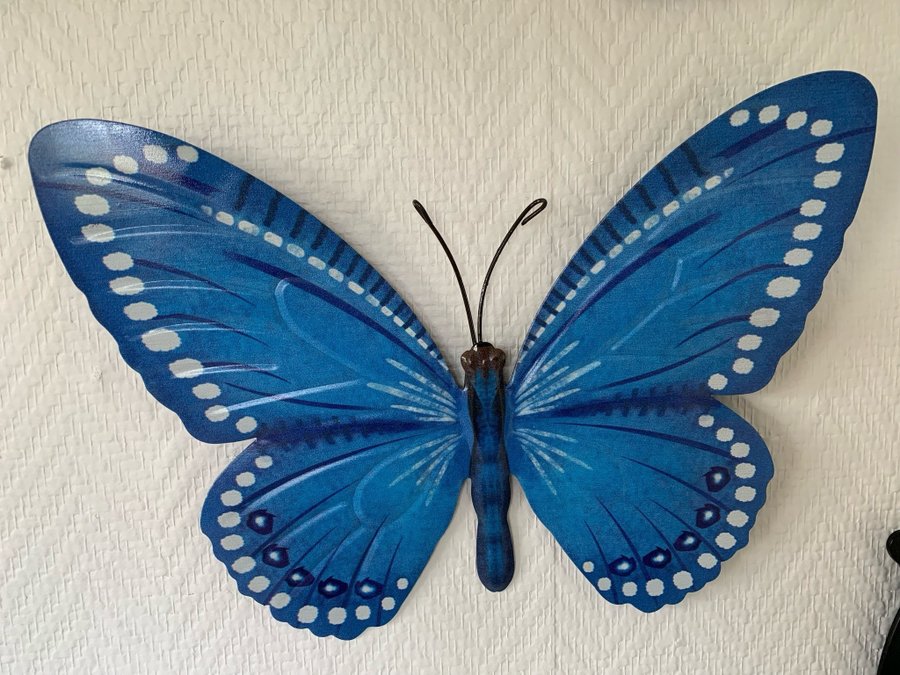 Blå fjäril väggdekoration