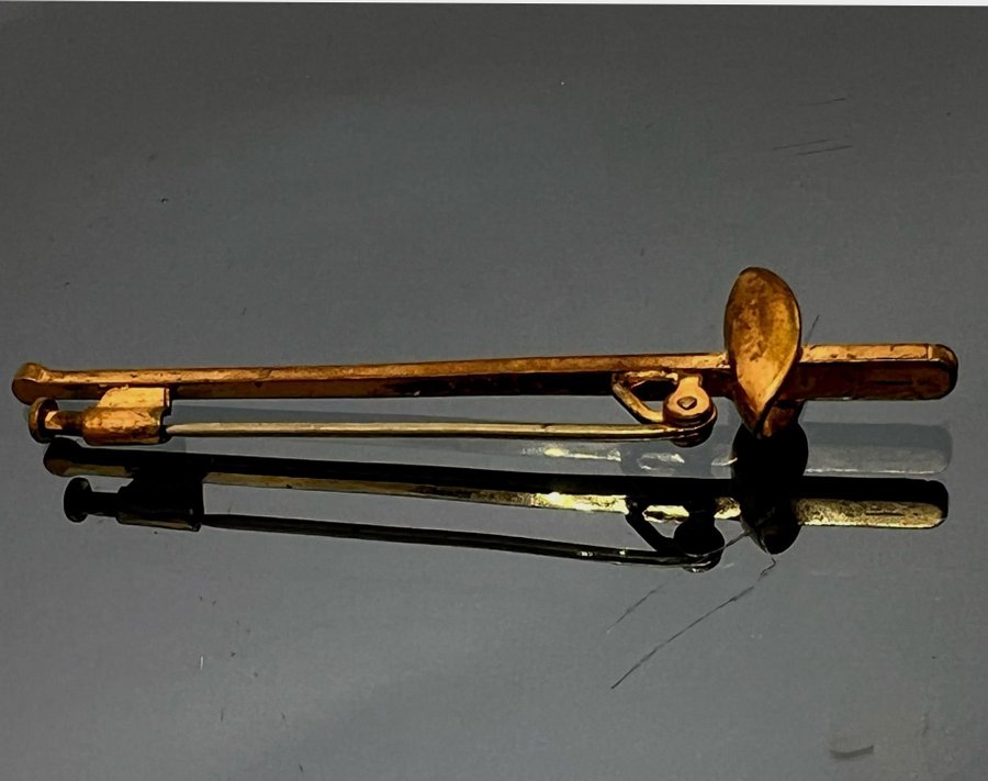 Antik udda guldig brosch gnistrande stenar svärd?