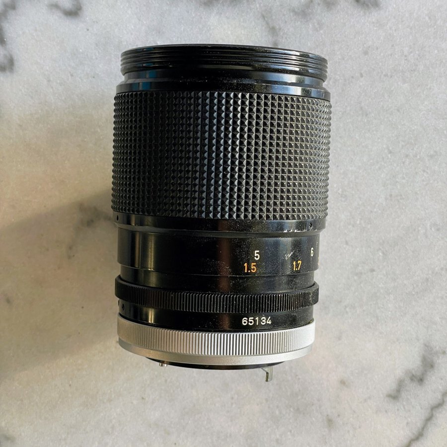 Canon FD 135mm f25 w/extendable lens hood + filter + case