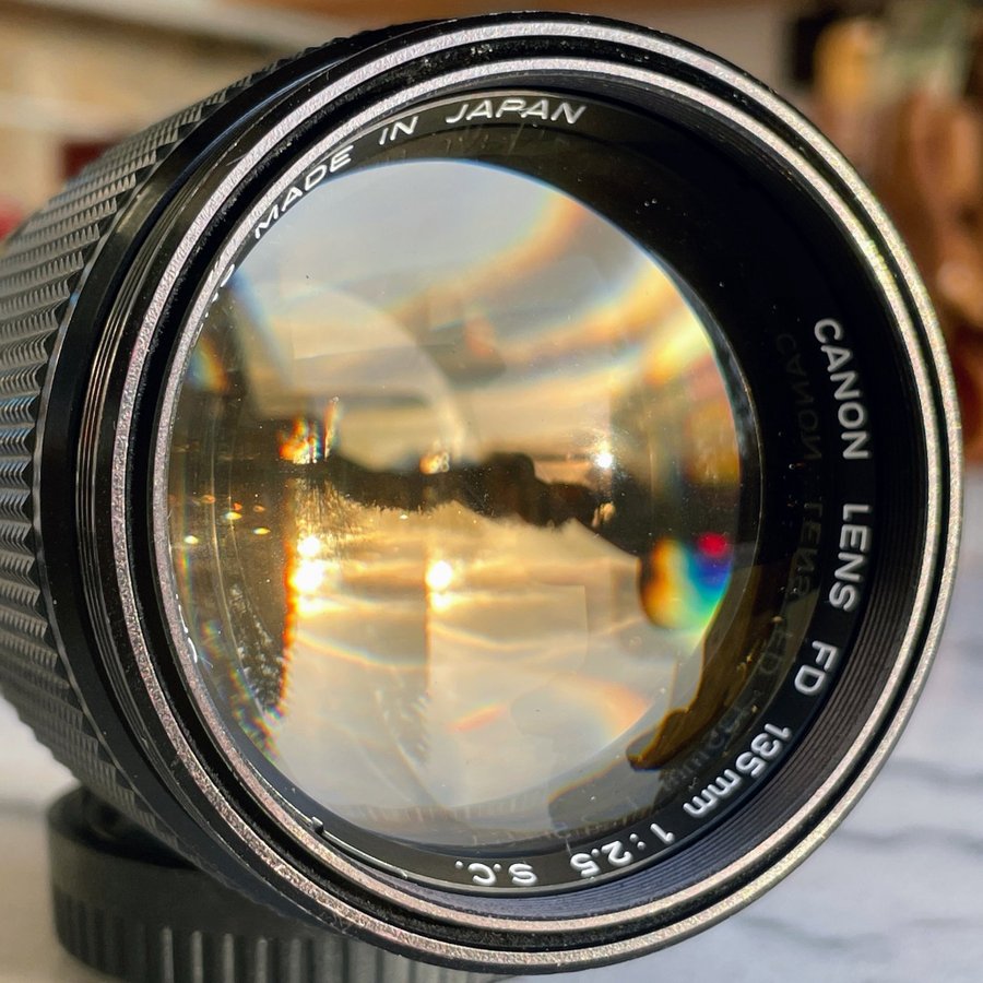 Canon FD 135mm f25 w/extendable lens hood + filter + case