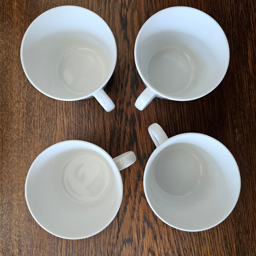 Fyra kaffekoppar med fat Smide av Berit Ternell för Gefle porslinsfabrik