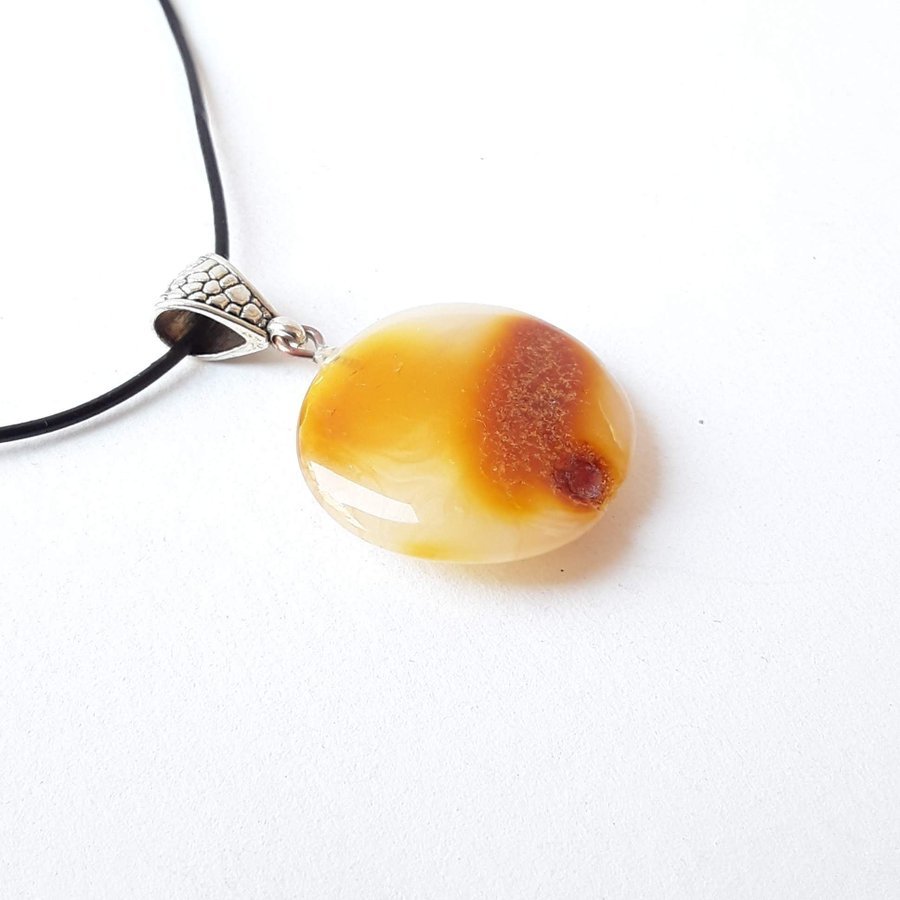 Baltic amber gem round circle yellow pendant on a black leather chain jewelry