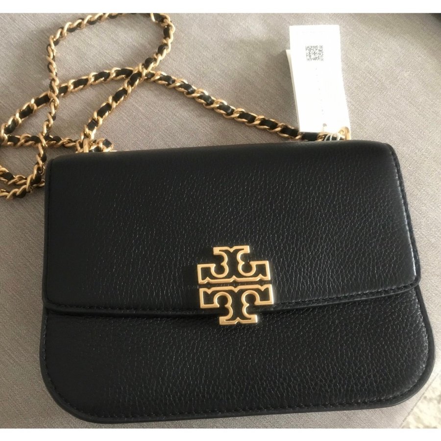 Oanvänd Tory Burch väska i skinn