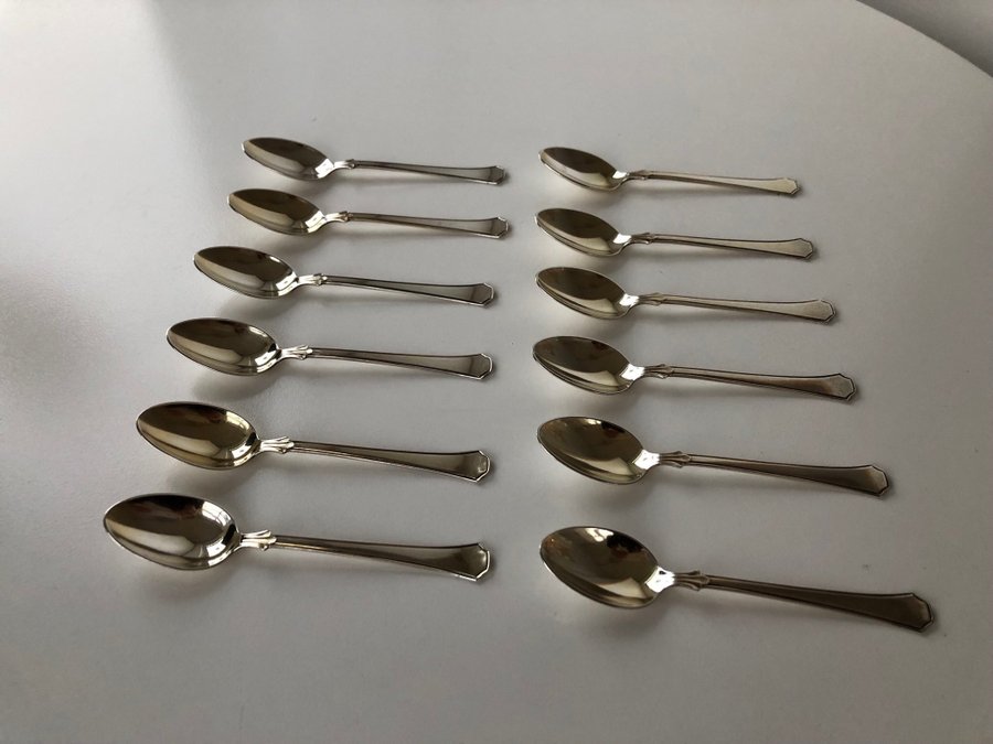 12 st teskedar i nysilver märkta med GABEXPNSALP vintage