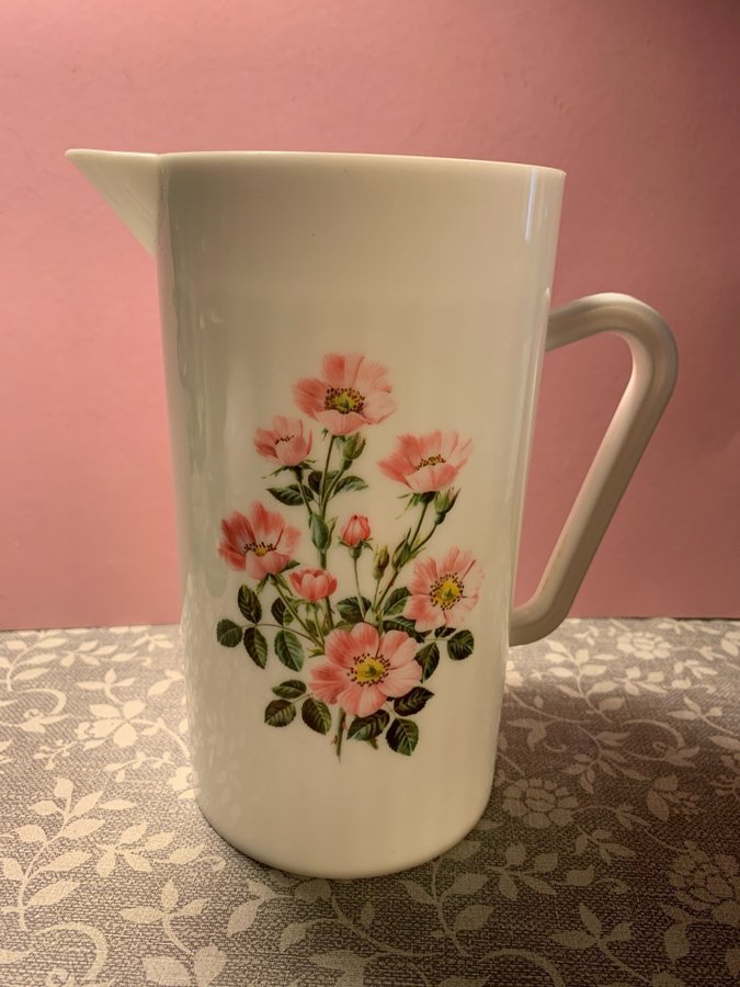 Retro Vit plasttillbringare med rosa blommor på Mycket fin Svensktillverkad