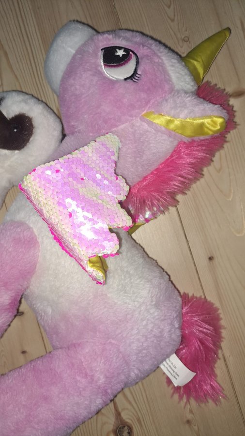 Stor enhörning unicorn med glittervingar och liten hund gosedjur mjukisdjur