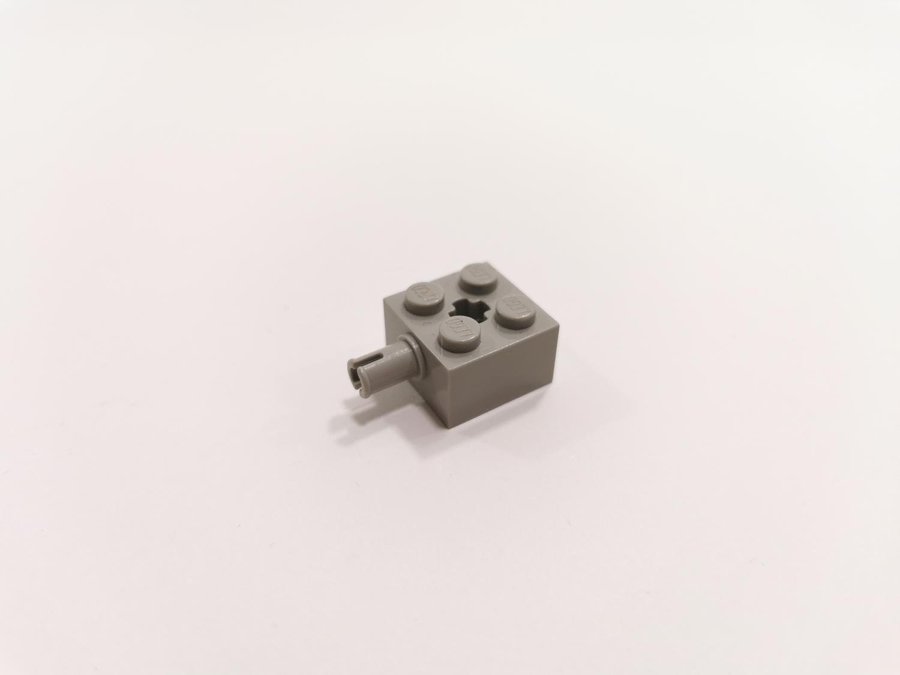 Lego - space - 2x2 - pin - med axelhål - part 6232 - ljusgrå (old light gray)