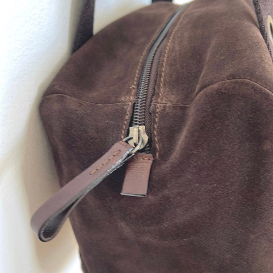 Nannini shoulder bag in suede and leather with metal rings