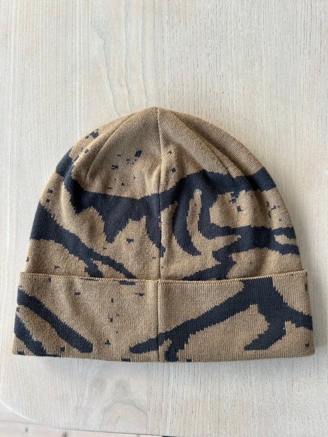 Arc'teryx mössa i modell: "Lightweight Grotto Toque NEUTRAL" beige och grafitgrå