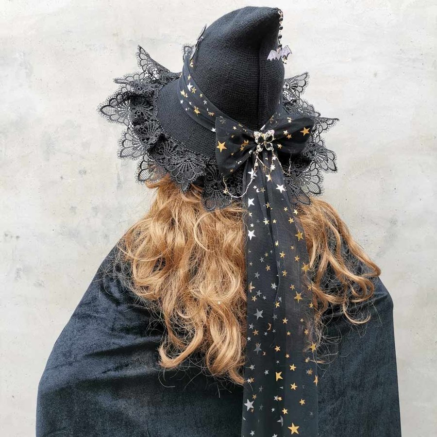 Handmade black wool blend witch hat with bow. Crochet Halloween wizard hat