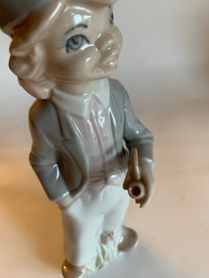 Casades porcelain figurine, young man with a hat  a pipe, 24 cm