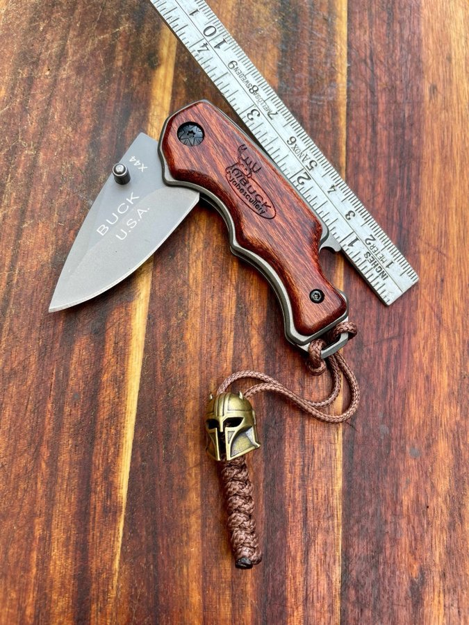 BUCK Fällkniv med flasköppnare  Lanyard