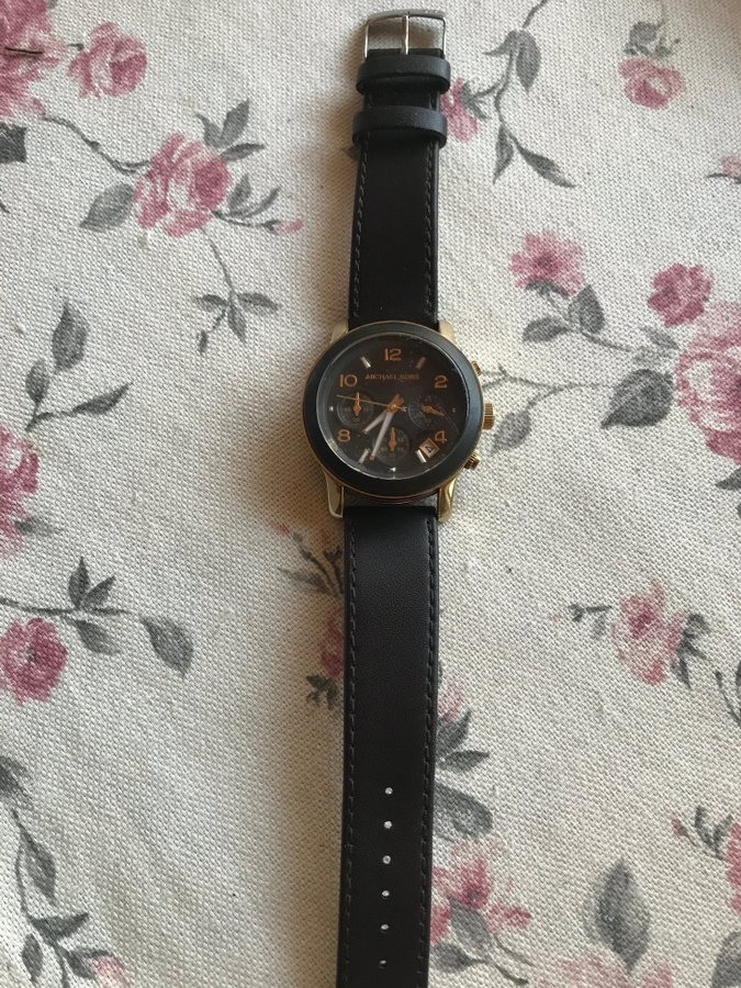 Michael Kors chronograph watch 10atm with a black leather strap