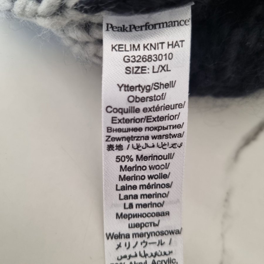 Peak Performance svart mössa, storlek L/XL, 50 procent merinoull