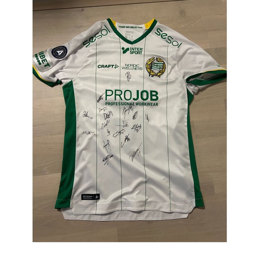 Raffertys matchtröja från Hammarby med alla spelarnas autografer på,