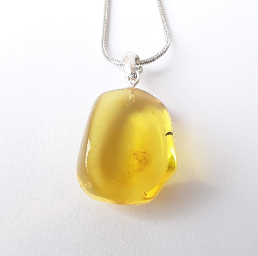 Clear Baltic amber oval pendant Yellow gemstone pendant on silver color chain