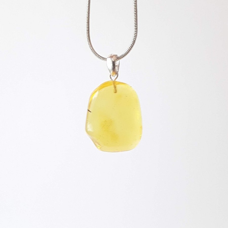 Clear Baltic amber oval pendant Yellow gemstone pendant on silver color chain