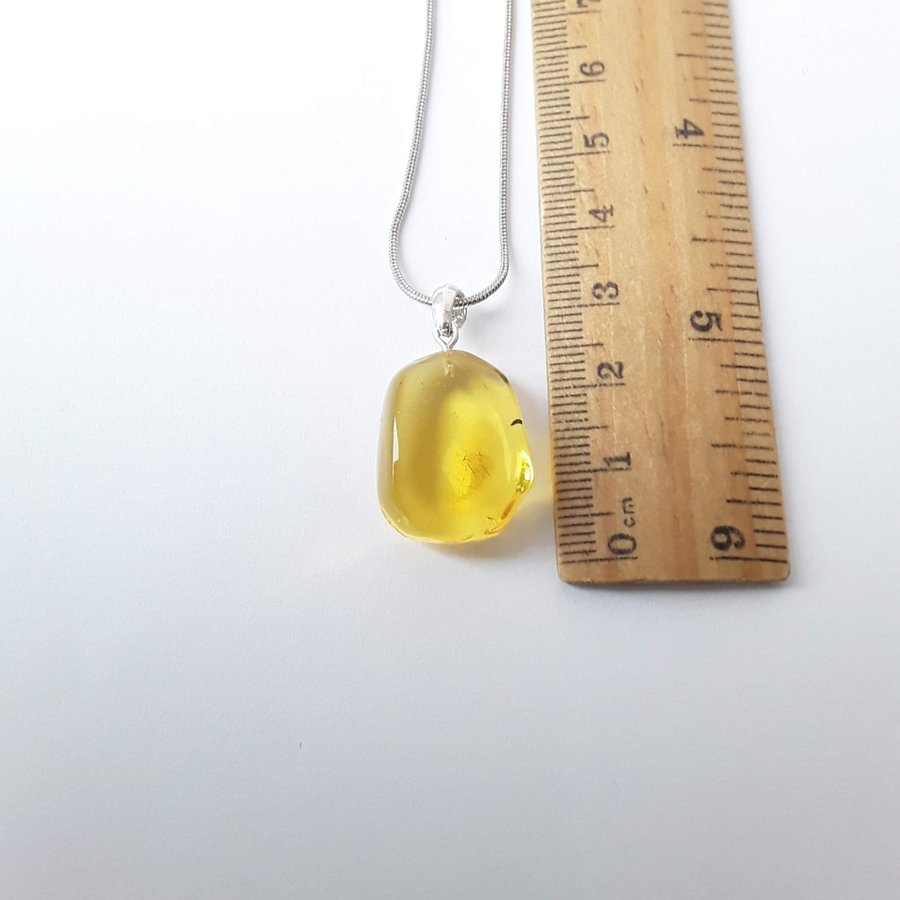 Clear Baltic amber oval pendant Yellow gemstone pendant on silver color chain