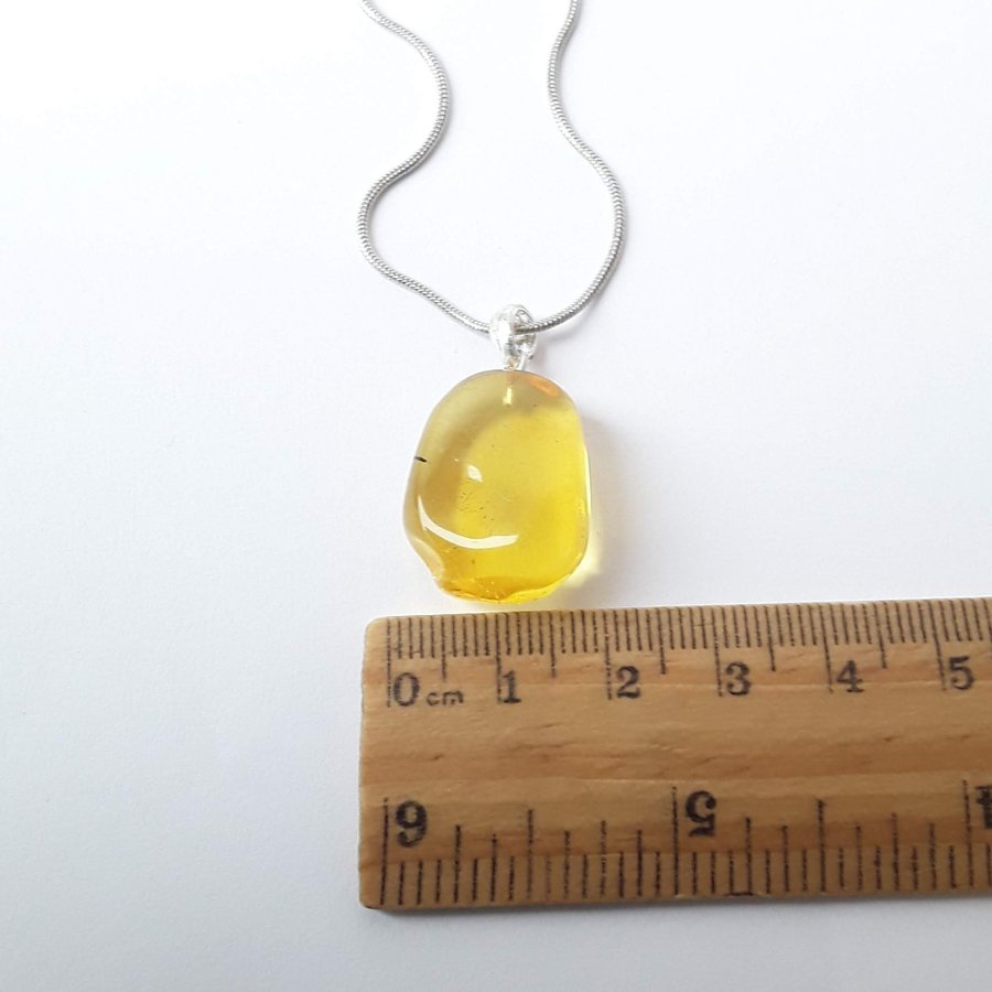 Clear Baltic amber oval pendant Yellow gemstone pendant on silver color chain