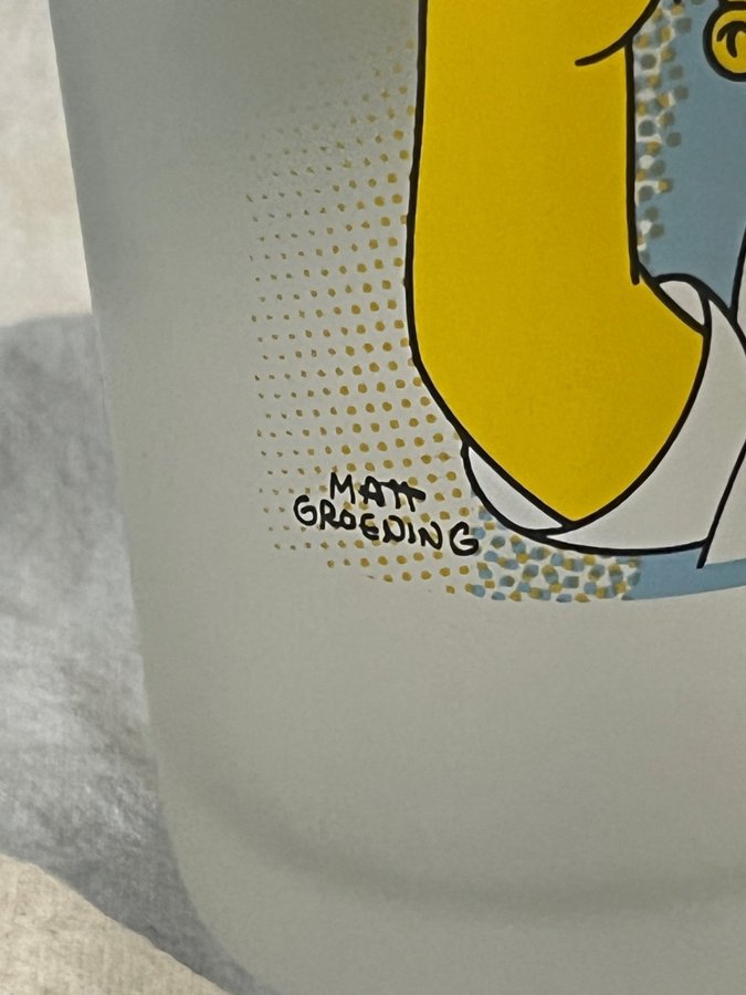 SIMPSONS GLAS MED TVÅ MOTIV