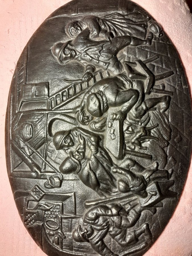 Relief i gjutjärn