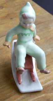 Hungary - Vintage Porcelain Figurine of a Boy on a Sled - Ungern