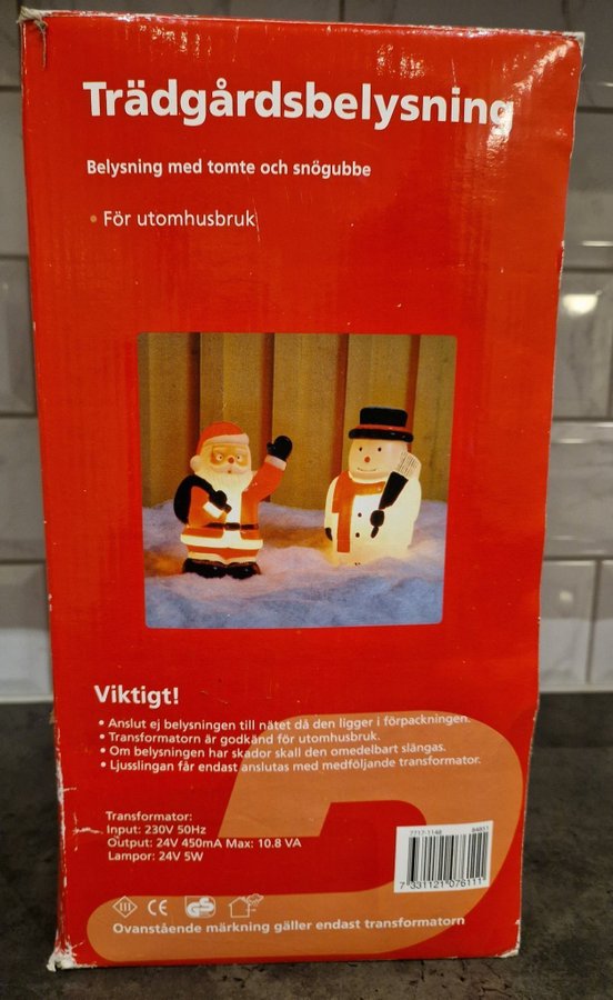 Trädgårdsbelysning med tomte och snögubbe