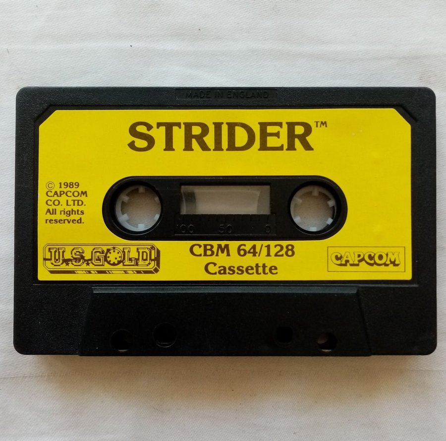 Strider (US Gold - Capcom) - Lös Tape - Kassett ->TESTAD<- Commodore 64 Spel