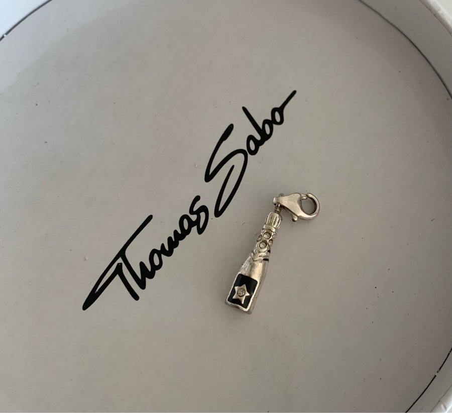 Thomas Sabo charm / berlock, champagne flaska med cubic zirconia stenar.