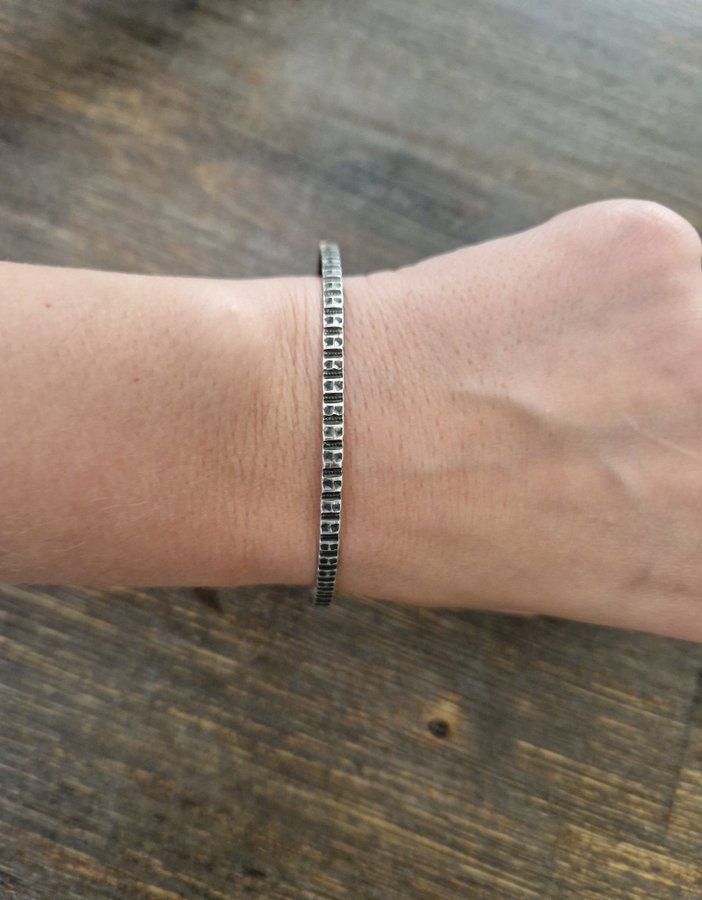 Silver armband stämplad 3 ringar och testaf