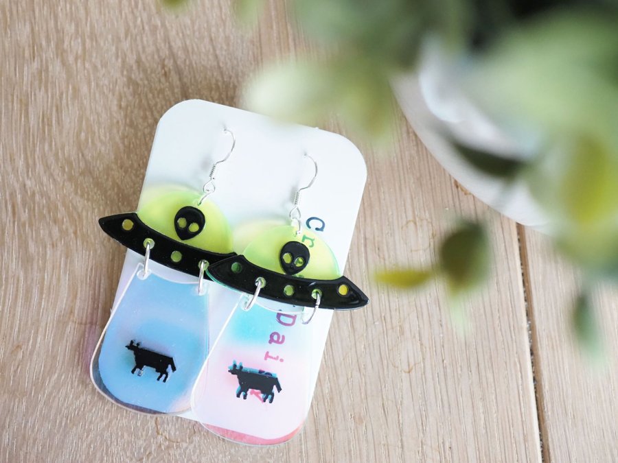 UFO kidnapping cow earrings