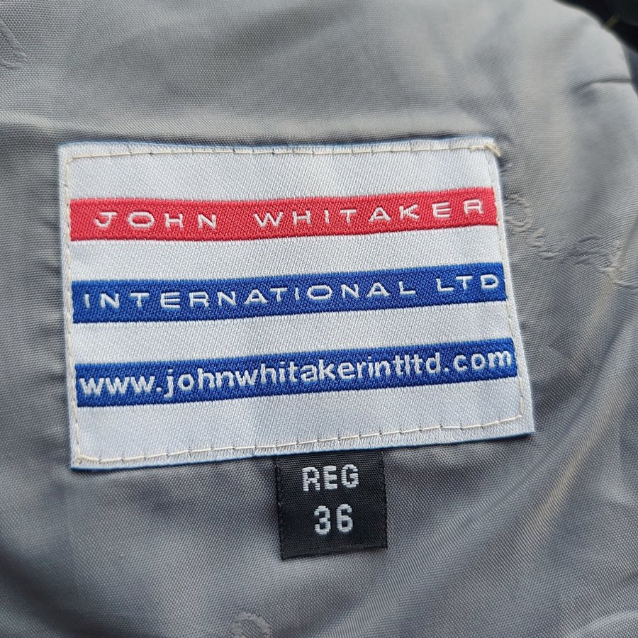 John Whitaker International Ltd mörkblå ridjacka, storlek 36