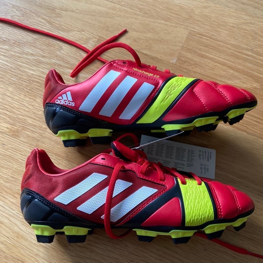 Nya fotbollsskor stl 38 2/3 Adidas male kille röd/gula nitrocharge 2.0